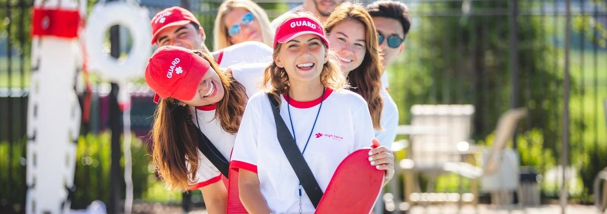 line of lifeguards at a swimming pool